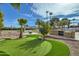 Landscaped backyard with putting green and built-in grill at 10241 N Nicklaus Dr, Fountain Hills, AZ 85268