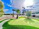 Putting green, pool, outdoor kitchen, and mountain views at 10241 N Nicklaus Dr, Fountain Hills, AZ 85268