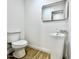 Modern powder room featuring a pedestal sink and updated fixtures at 10241 N Nicklaus Dr, Fountain Hills, AZ 85268