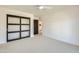 Spacious bedroom with sliding barn door and ceiling fan at 10241 N Nicklaus Dr, Fountain Hills, AZ 85268