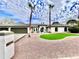 Front view of single story home with landscaped lawn at 10241 N Nicklaus Dr, Fountain Hills, AZ 85268