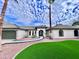 Stunning curb appeal with artificial turf and walkway at 10241 N Nicklaus Dr, Fountain Hills, AZ 85268