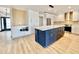 Modern kitchen with large island and white cabinets at 10241 N Nicklaus Dr, Fountain Hills, AZ 85268