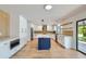 Modern kitchen with island, white cabinets, and quartz countertops at 10241 N Nicklaus Dr, Fountain Hills, AZ 85268