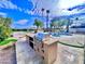 Modern outdoor kitchen with grill and bar at 10241 N Nicklaus Dr, Fountain Hills, AZ 85268