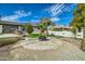 Charming patio area with fire pit and landscaping at 10241 N Nicklaus Dr, Fountain Hills, AZ 85268