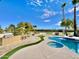 Luxury pool and spa with outdoor kitchen and bar at 10241 N Nicklaus Dr, Fountain Hills, AZ 85268