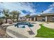 Inviting pool area with diving board and fire pit at 10241 N Nicklaus Dr, Fountain Hills, AZ 85268