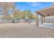 Large backyard with gravel landscaping and playset at 1036 E Oak Rd, San Tan Valley, AZ 85140