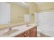 Clean bathroom with double vanity, tub, and neutral-toned decor at 1036 E Oak Rd, San Tan Valley, AZ 85140
