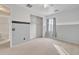 Bedroom with window, closet, and neutral-toned wall paint at 1036 E Oak Rd, San Tan Valley, AZ 85140