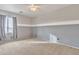 Well-lit bedroom with neutral walls, carpet, and a ceiling fan at 1036 E Oak Rd, San Tan Valley, AZ 85140
