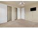 Spacious bedroom with double closets and neutral carpeting at 1036 E Oak Rd, San Tan Valley, AZ 85140