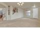 Entryway with staircase, carpet flooring, and natural light at 1036 E Oak Rd, San Tan Valley, AZ 85140