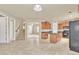 Spacious kitchen with an island, wood cabinets, and tile flooring at 1036 E Oak Rd, San Tan Valley, AZ 85140