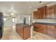 Kitchen with wood cabinets, granite countertops, and a large island at 1036 E Oak Rd, San Tan Valley, AZ 85140