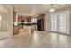 Spacious kitchen with island, dark wood cabinets, and tile flooring at 1036 E Oak Rd, San Tan Valley, AZ 85140