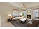 Living room with fireplace, contemporary furniture and large windows at 1036 E Oak Rd, San Tan Valley, AZ 85140