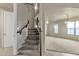 Elegant staircase leading to the upper level at 1036 E Oak Rd, San Tan Valley, AZ 85140