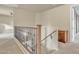 Upstairs hallway with built-in wooden desk and railing at 1036 E Oak Rd, San Tan Valley, AZ 85140