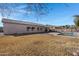 Spacious backyard with a pool and grassy area at 1102 E Bartlett Way, Chandler, AZ 85249