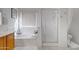 Bathroom features a bathtub, shower, and wood vanity at 1102 E Bartlett Way, Chandler, AZ 85249