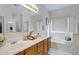 Large bathroom with double vanity, soaking tub, and shower at 1102 E Bartlett Way, Chandler, AZ 85249