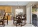Kitchen dining area with table and chairs, near sliding door to patio at 1102 E Bartlett Way, Chandler, AZ 85249