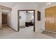 Entryway with view to home office with built-in desk at 1102 E Bartlett Way, Chandler, AZ 85249