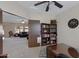 Bright home office features built-in shelving and view into living room at 1102 E Bartlett Way, Chandler, AZ 85249
