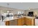 Eat-in kitchen with island, stainless steel appliances, and views to backyard at 1102 E Bartlett Way, Chandler, AZ 85249