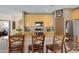 Island kitchen with wood cabinets and stainless steel appliances at 1102 E Bartlett Way, Chandler, AZ 85249