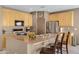 Modern kitchen with stainless steel appliances and an island at 1102 E Bartlett Way, Chandler, AZ 85249