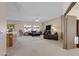 Spacious living room with comfortable seating and carpet at 1102 E Bartlett Way, Chandler, AZ 85249
