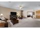 Spacious living room featuring comfortable seating and a large TV at 1102 E Bartlett Way, Chandler, AZ 85249