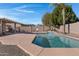 Inviting kidney-shaped pool with a large patio at 1102 E Bartlett Way, Chandler, AZ 85249