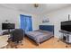 Bright bedroom with a comfortable bed, workspace, and plenty of natural light at 11030 W Pleasant Valley W Rd, Sun City, AZ 85351