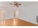 Spacious bedroom with ceiling fan and wood flooring at 11030 W Pleasant Valley W Rd, Sun City, AZ 85351