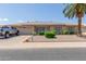 Ranch-style home with solar panels and landscaped yard at 11030 W Pleasant Valley W Rd, Sun City, AZ 85351