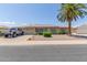 Ranch-style home with solar panels and landscaped yard at 11030 W Pleasant Valley W Rd, Sun City, AZ 85351