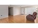 Living room with hardwood floors and access to hallway at 11030 W Pleasant Valley W Rd, Sun City, AZ 85351