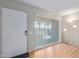 Living room with hardwood floors and sliding glass doors at 11030 W Pleasant Valley W Rd, Sun City, AZ 85351