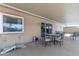 Covered patio with outdoor furniture, perfect for relaxing and entertaining at 11030 W Pleasant Valley W Rd, Sun City, AZ 85351