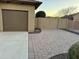 Neat paved driveway with access to garage and gated entrance at 11105 E Quintana Ave, Mesa, AZ 85212