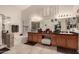 Bathroom with double sinks, a large mirror, and a bathtub at 1350 W Seascape Dr, Gilbert, AZ 85233