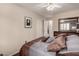 Guest bedroom with a queen bed and access to a shared bathroom at 1350 W Seascape Dr, Gilbert, AZ 85233