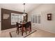Charming dining area with a wood table and four chairs near kitchen at 1350 W Seascape Dr, Gilbert, AZ 85233