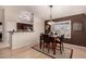 Bright dining room with a table and chairs, open to the kitchen at 1350 W Seascape Dr, Gilbert, AZ 85233