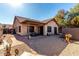Home exterior showcasing a covered patio and landscaping at 1350 W Seascape Dr, Gilbert, AZ 85233