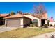 Front view of charming house with a two car garage at 1350 W Seascape Dr, Gilbert, AZ 85233